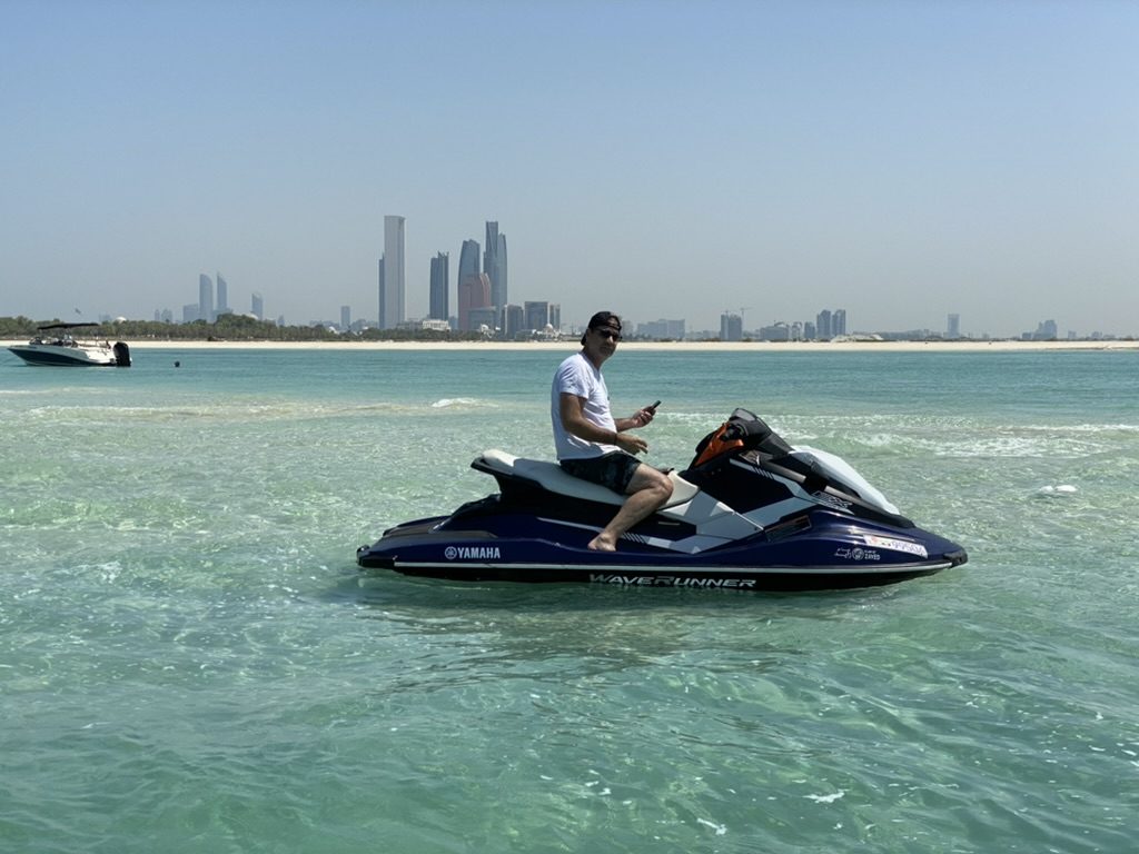 Rider with tour boat and skyline